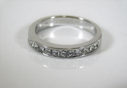 An 18ct white gold ring set with princess cut diam