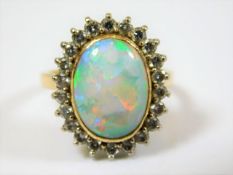 A good 18ct gold opal & diamond ring with approx.