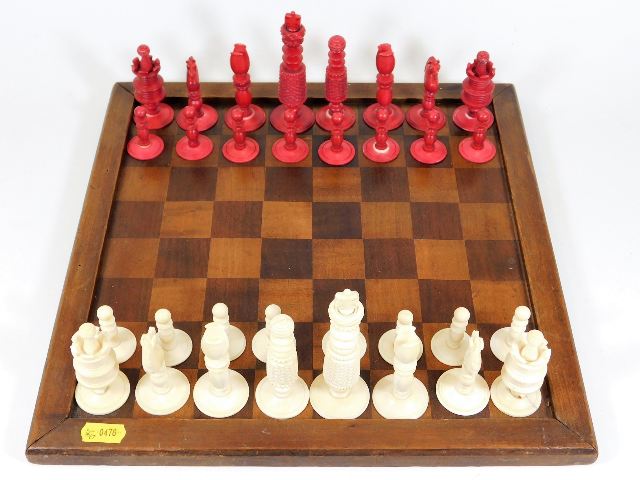 A 19thC. ivory chess set with board king 4.125in h