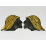 A pair of early 20thC. bronze arab head plaques re