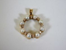 An 18ct gold pearl & diamond pendant 5.6g