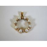 An 18ct gold pearl & diamond pendant 5.6g