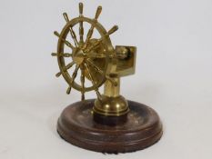 A brass yacht wheel nut cracker