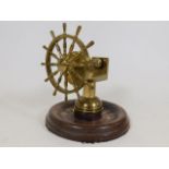 A brass yacht wheel nut cracker