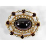 A 9ct gold brooch set with garnets & pearls with c