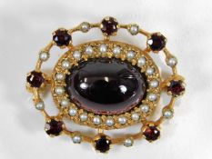 A 9ct gold brooch set with garnets & pearls with c