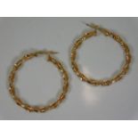 A pair of 9ct gold twist earrings 1.5in diameter 2