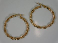 A pair of 9ct gold twist earrings 1.5in diameter 2