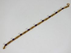 A 9ct gold bracelet with amethyst 7.5in long 4.6g