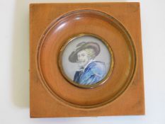 A walnut mounted watercolour on ivory panel depict