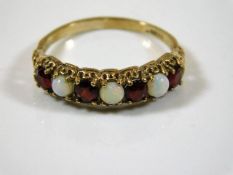 A 9ct gold garnet & opal ring size O/M 1.8g