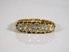 An 18ct gold five stone ring set with approx. 1ct