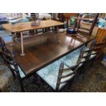 An oak dining table & eight chairs