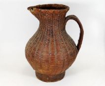 A North American Indian style antique woven wicker water jug