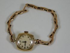 A ladies 9ct gold watch & strap 10.9g