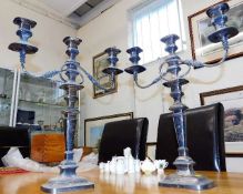 A pair of George III silver on copper candlesticks