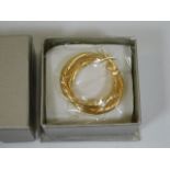 A boxed & sealed as new pair of 9ct gold earrings