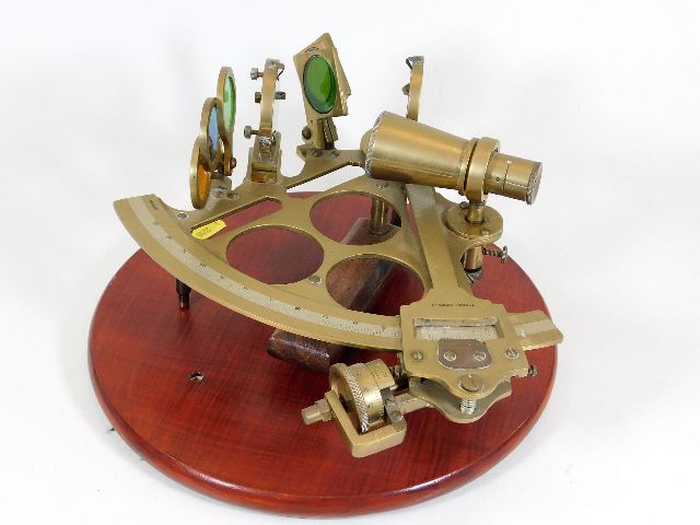 A mounted brass Stanley of London sextant