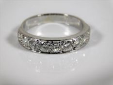 An 18ct white gold ring set with nine diamonds of