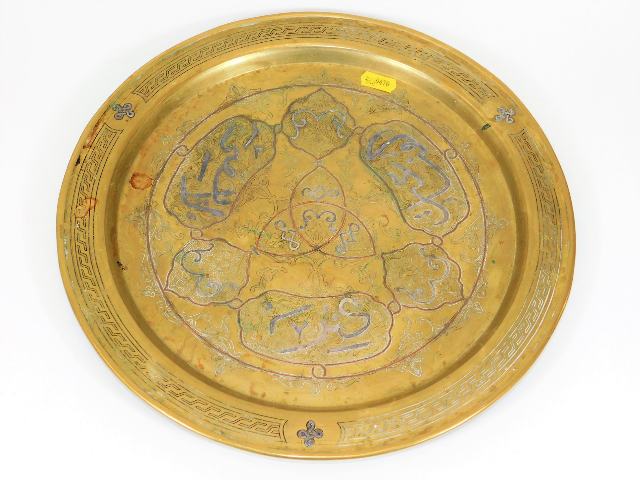 A 19thC. Islamic brass tray with silver overlay 13