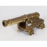 A brass mounted desk cannon