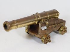 A brass mounted desk cannon