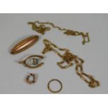 A 9ct gold wishbone brooch. two 9ct gold chains a/