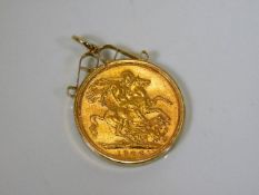 A 9ct gold mounted 1906 22ct full gold sovereign 9