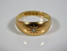 An 18ct gold ring set with small diamond size O 2.