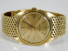 An 18ct gold Omega Constellation automatic Chronometer watch 126.4g, small crack to glass, runs very