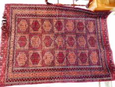 A Persian Bokhara style rug 71in x 50in