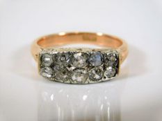 An 18ct gold ring set with two rows of diamonds, a