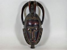 An African tribal art carved ceremonial mask 15.5i