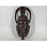 An African tribal art carved ceremonial mask 15.5i