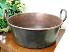 A c.1900 brass handled copper wash basin 16.5in wi