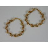 A pair of 9ct gold twist earrings 1.25in diameter