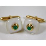 A fine pair of mother of pearl & emerald cufflinks