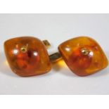 A pair of Russian marked yellow metal amber cuffli