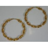 A 9ct gold pair of twist hoop earrings diameter 2i