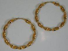 A 9ct gold pair of twist hoop earrings diameter 2i