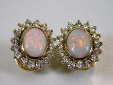 A good pair of 18ct gold screw stud fitting opal &