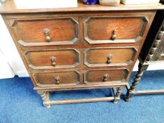 An early 20thC. oak chest with barley twist legs