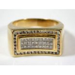 A large 14ct gold ring set with 63 diamonds 12.5g