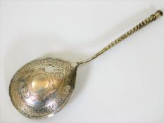 A Russian silver spoon with engraved decor & cyril