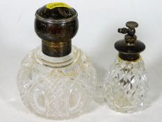 A silver topped scent bottle twinned with silver t