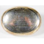 A silver snuff box with inscription of kind: award