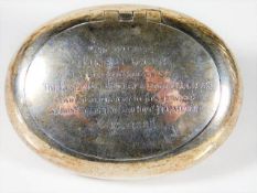 A silver snuff box with inscription of kind: award