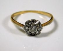 An 18ct Victorian daisy ring set with approx. 0.5c