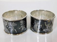 Two Thai silver napkin rings with engraved decor