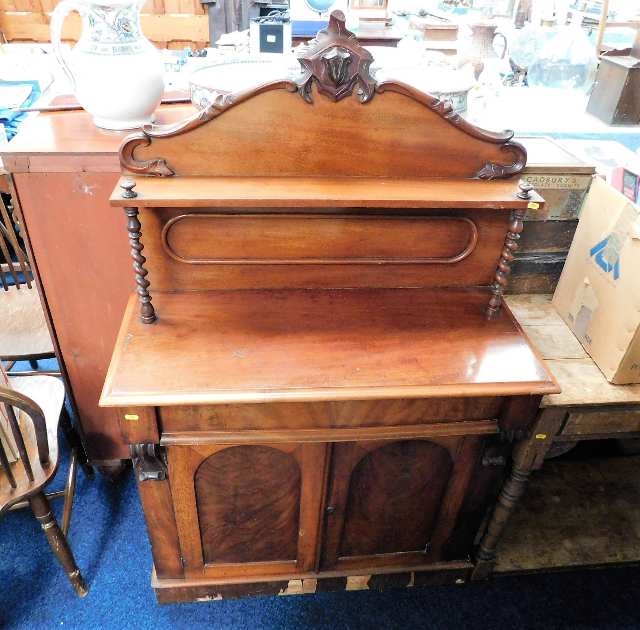 A mahogany veneer chiffonier with barley twist sup